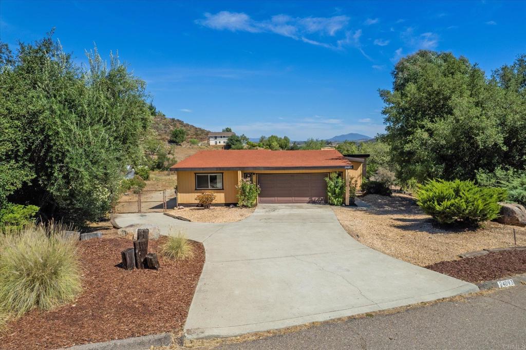 24093 Sargeant Road Ramona, CA 92065 - Photo 34 of 57 a view of a house with backyard porch and sitting area