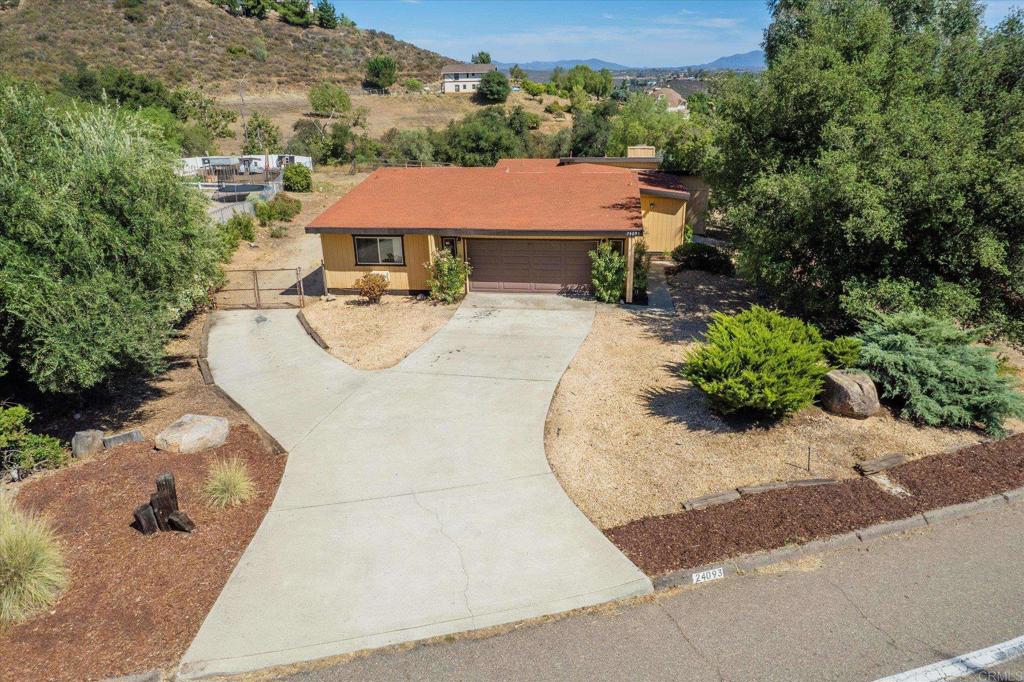 24093 Sargeant Road Ramona, CA 92065 - Photo 37 of 57 an aerial view of a house with swimming pool and garden