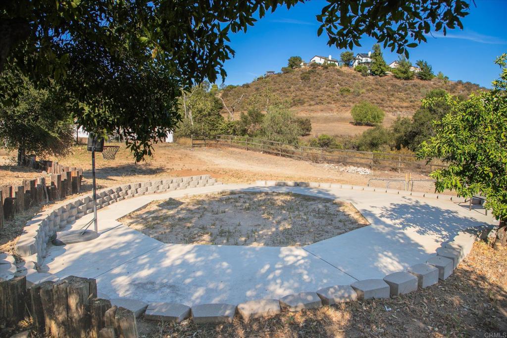 24093 Sargeant Road Ramona, CA 92065 - Photo 52 of 57 a view of a yard with a tree