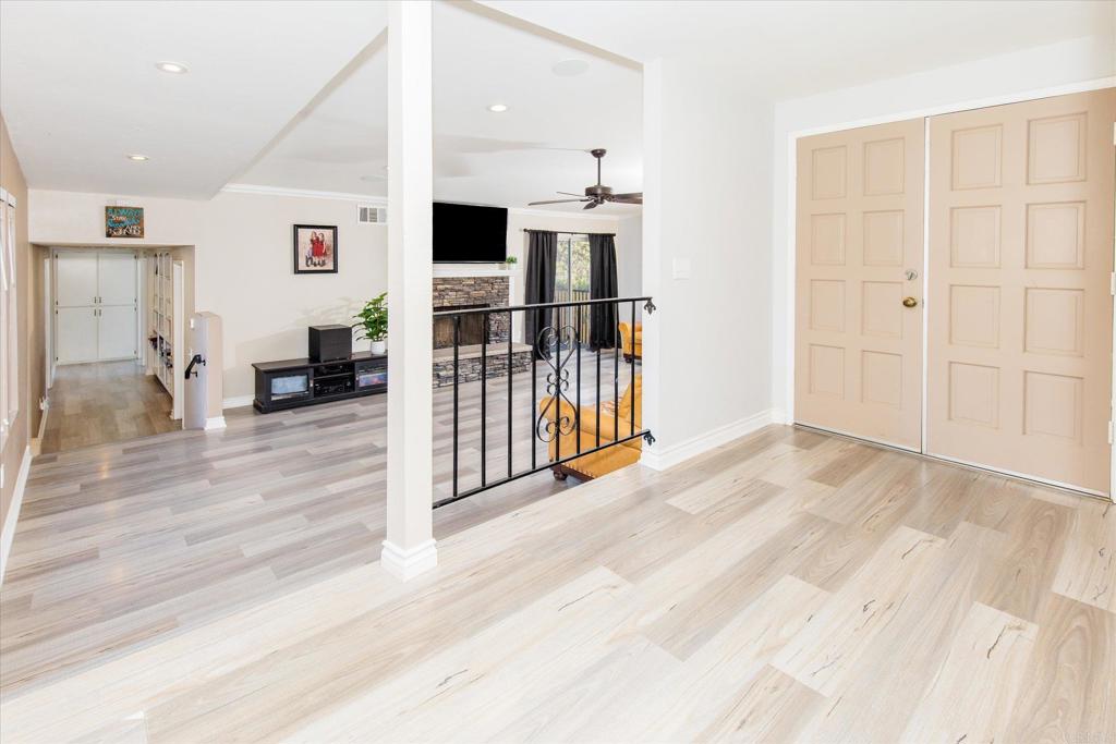 24093 Sargeant Road Ramona, CA 92065 - Photo 6 of 57 an empty room with wooden floor and windows