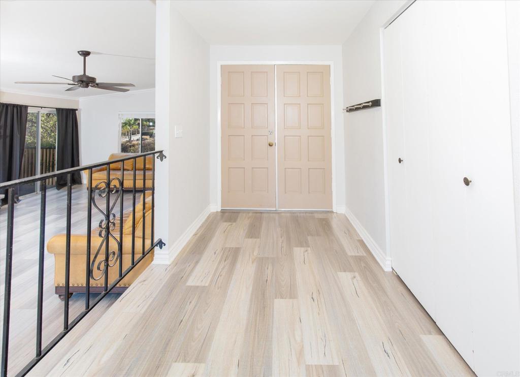 24093 Sargeant Road Ramona, CA 92065 - Photo 7 of 57 a view of a hallway with wooden floor