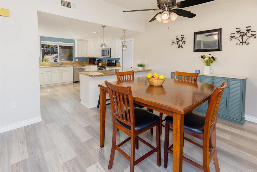 24093 Sargeant Road Ramona, CA 92065 - Photo 9 of 57 a view of a dining room with furniture and a kitchen