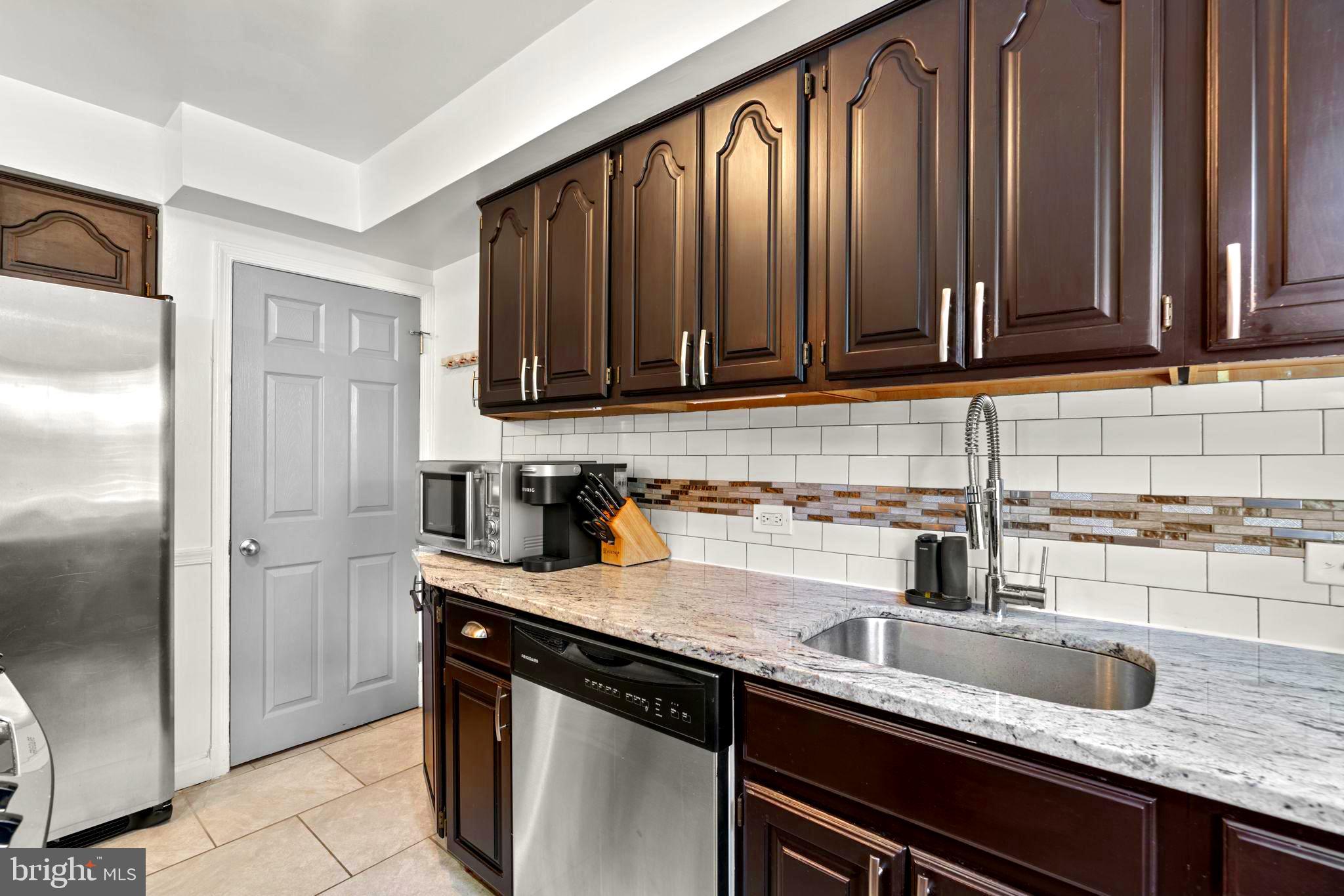 1126 Elm Road Baltimore, MD 21227 - Photo 13 of 30 Beautiful countertops and custom backsplash