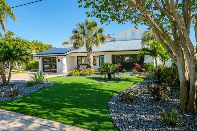 a front view of a house with garden