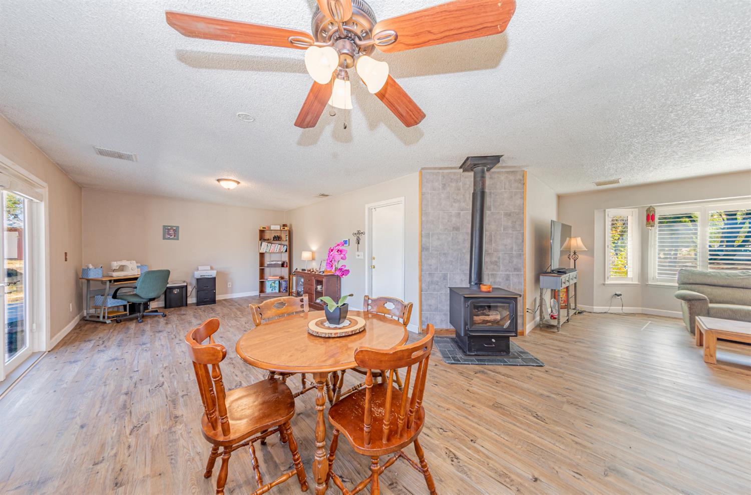 a view of a dining room with furniture and wooden floor