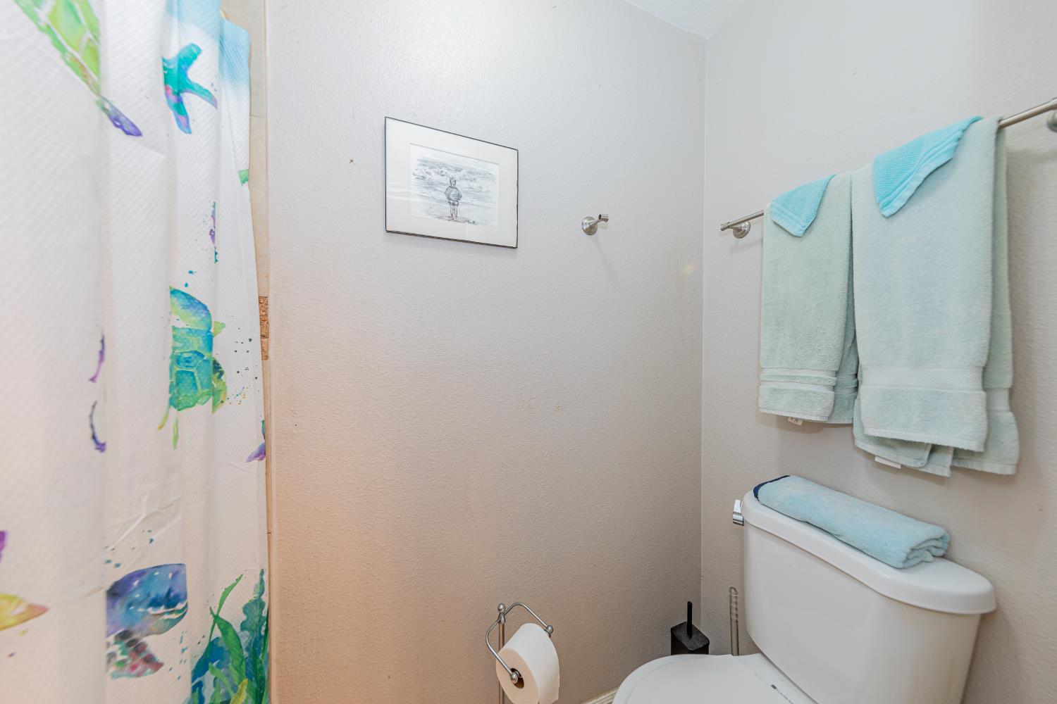 47165 Modoc Road Coarsegold, CA 93614 - Photo 19 of 33 a white toilet sitting next to a bathroom sink