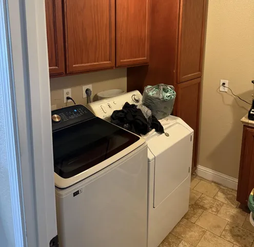 a close view of a utility room with washer and dryer
