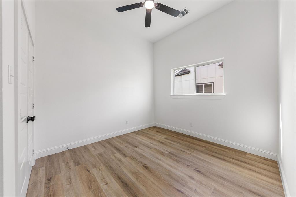 1247 Bonham Street Paris, TX 75460 - Photo 13 of 18 wooden floor in an empty room