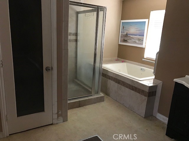16239 Chicago Avenue Bellflower, CA 90706 - Photo 15 of 30 a bathroom with bathtub and shower