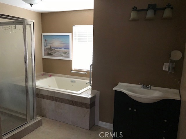 16239 Chicago Avenue Bellflower, CA 90706 - Photo 16 of 30 a bathroom with a sink and a bathtub