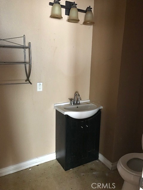 16239 Chicago Avenue Bellflower, CA 90706 - Photo 22 of 30 a bathroom with a sink and a toilet