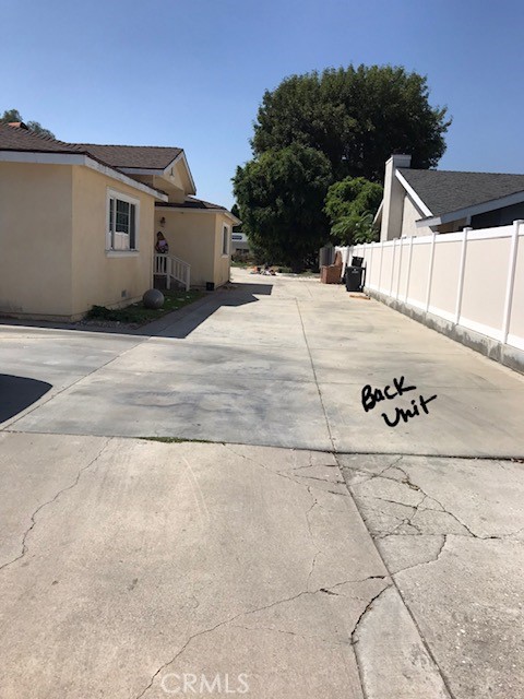 16239 Chicago Avenue Bellflower, CA 90706 - Photo 24 of 30 a view of a white house with a yard