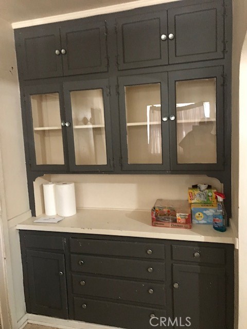 16239 Chicago Avenue Bellflower, CA 90706 - Photo 29 of 30 a bathroom with a sink a mirror and cabinets