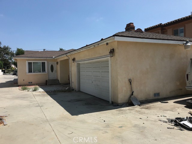 16239 Chicago Avenue Bellflower, CA 90706 - Photo 9 of 30 a front view of a house with a yard