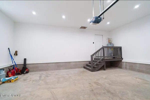 a kitchen with storage and utility