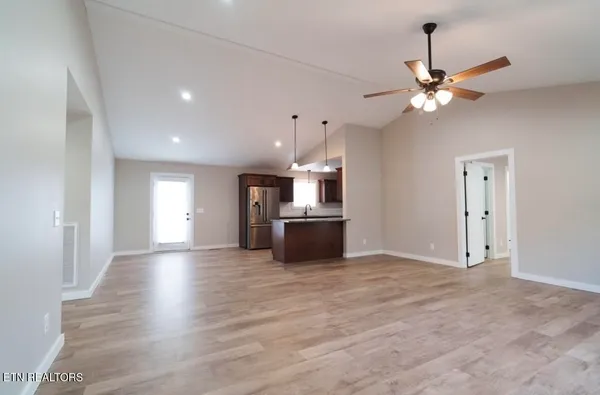 a view of a kitchen with a sink and a window