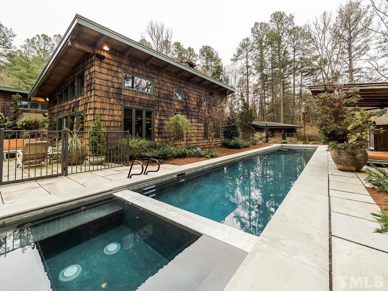 Truly a custom masterpiece...amazing cherry hardwood sourced from Sparta, NC. Stones to build the fireplace were pulled directly from the pond!