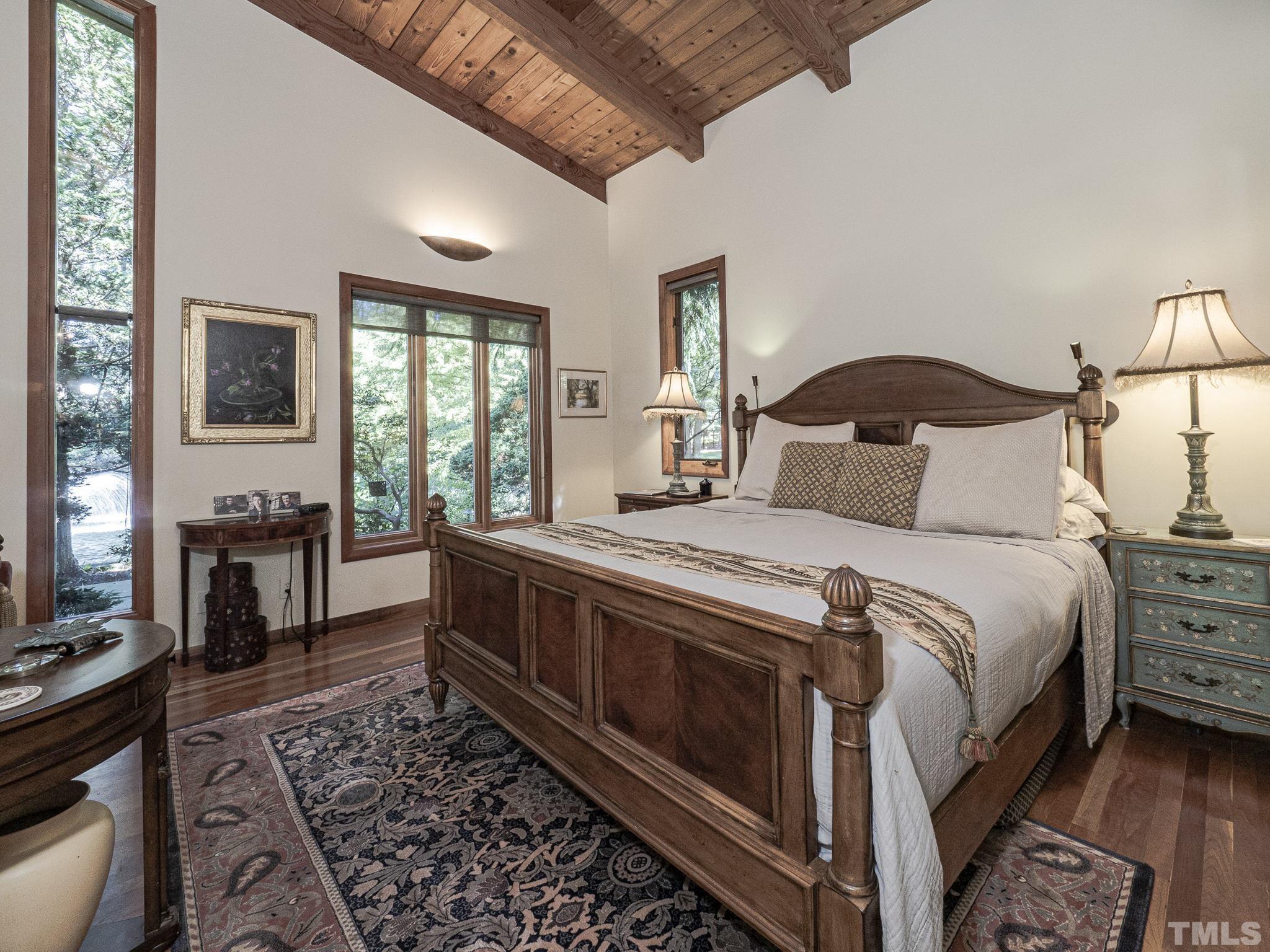 3916 Cole Mill Road Durham, NC 27712 - Photo 10 of 30 Private master bedroom includes Douglas Fir hand hewn beams and tongue and groove vaulted ceilings.