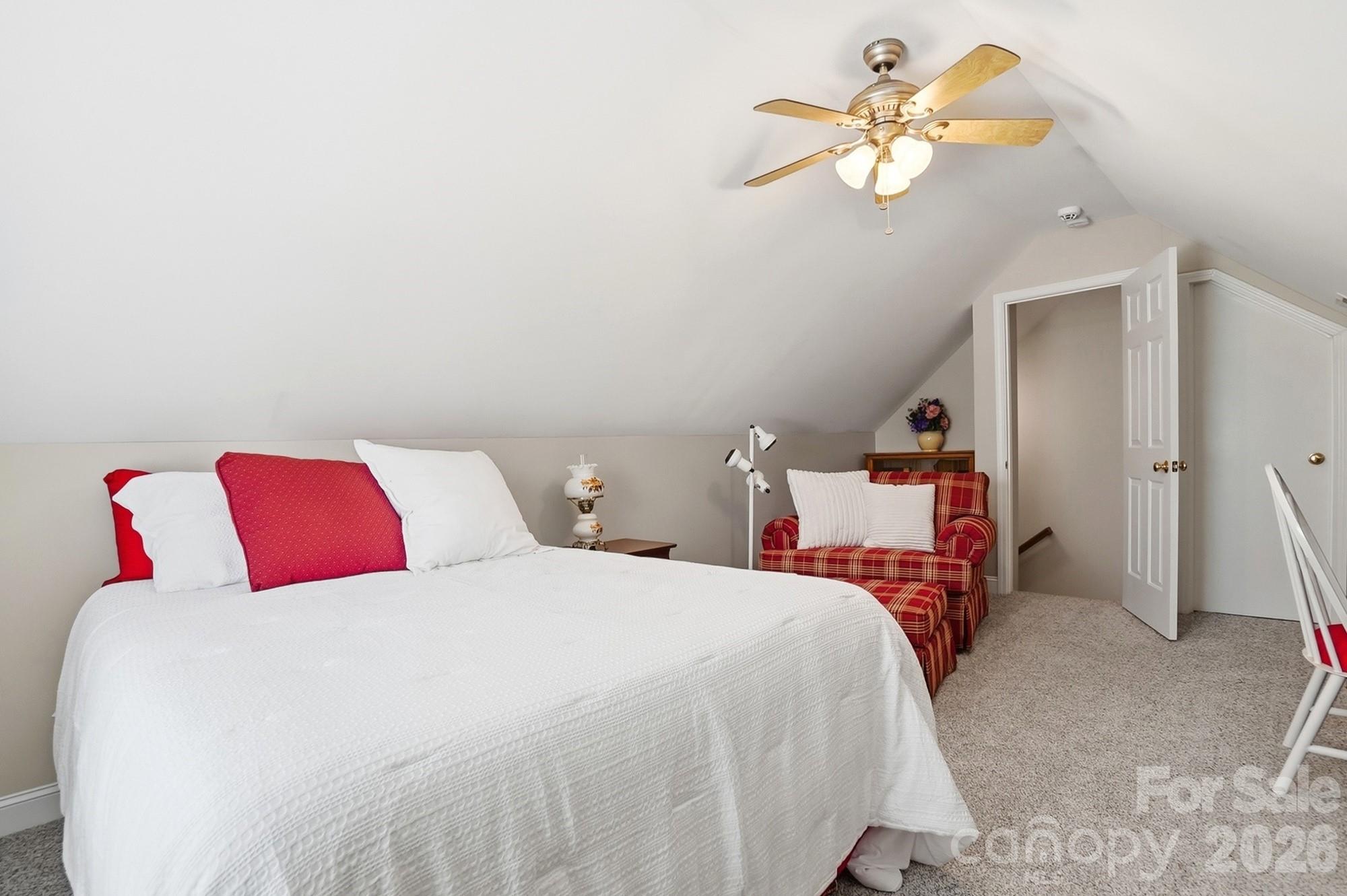 3324 Muddy Creek Road Midland, NC 28107 - Photo 40 of 46 a bed room with a bed and a chandelier