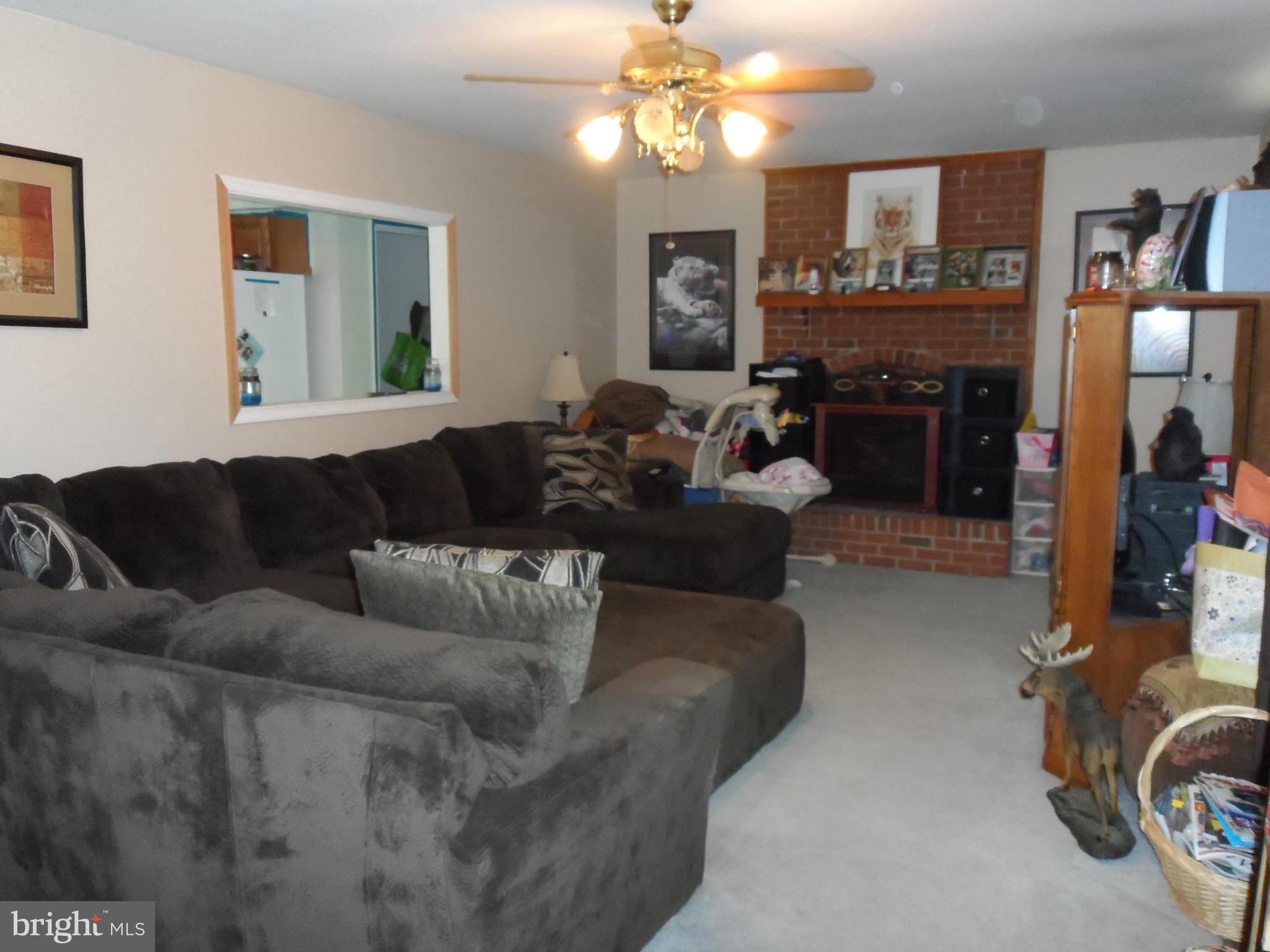 12376 Prim Road King George, VA 22485 - Photo 5 of 7 Living Room brick fireplace