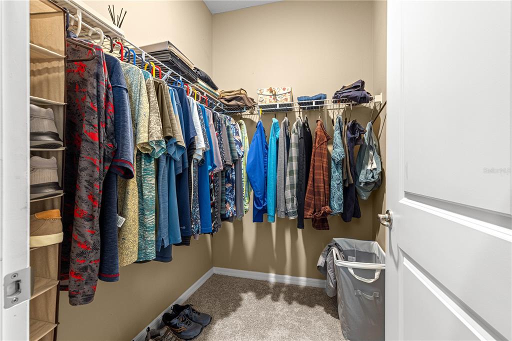 6365 Southwest 88th Loop Ocala, FL 34476 - Photo 21 of 35 a view of walk in closet with clothes