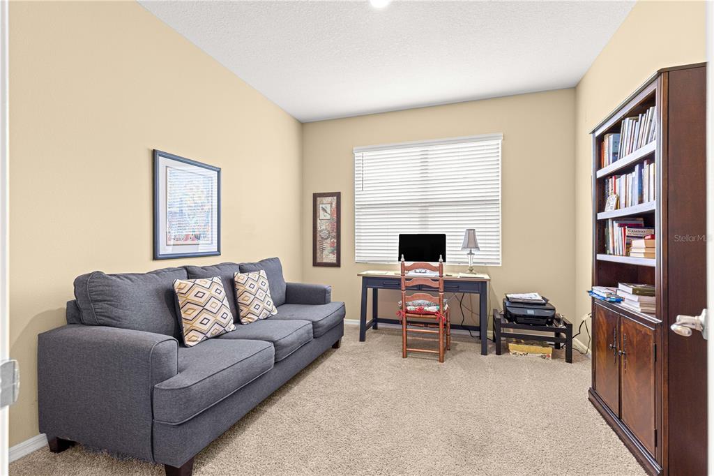 6365 Southwest 88th Loop Ocala, FL 34476 - Photo 23 of 35 a living room with furniture and a flat screen tv