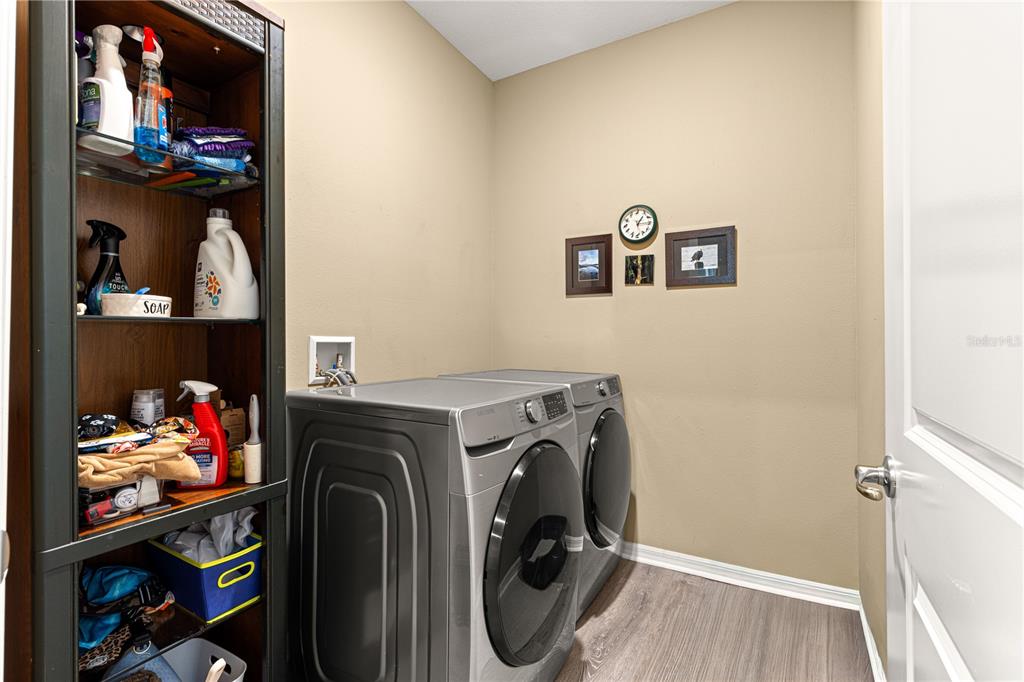 6365 Southwest 88th Loop Ocala, FL 34476 - Photo 26 of 35 a utility room with dryer washer and other items