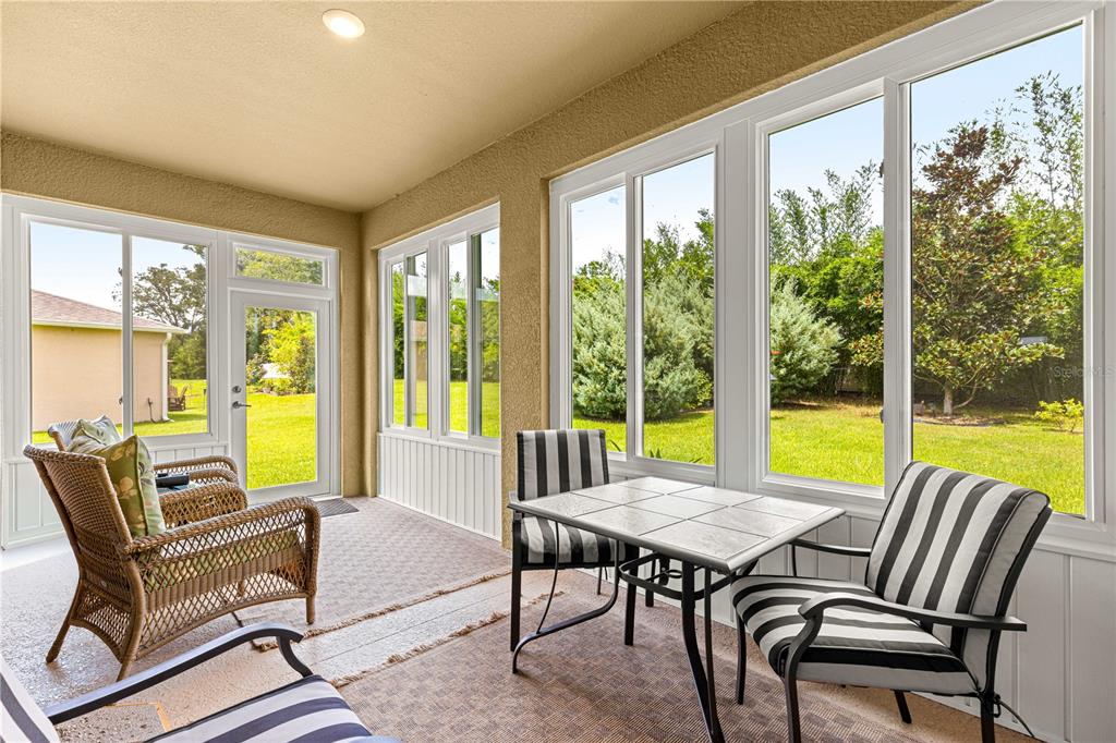 6365 Southwest 88th Loop Ocala, FL 34476 - Photo 29 of 35 a living room with furniture and a large window
