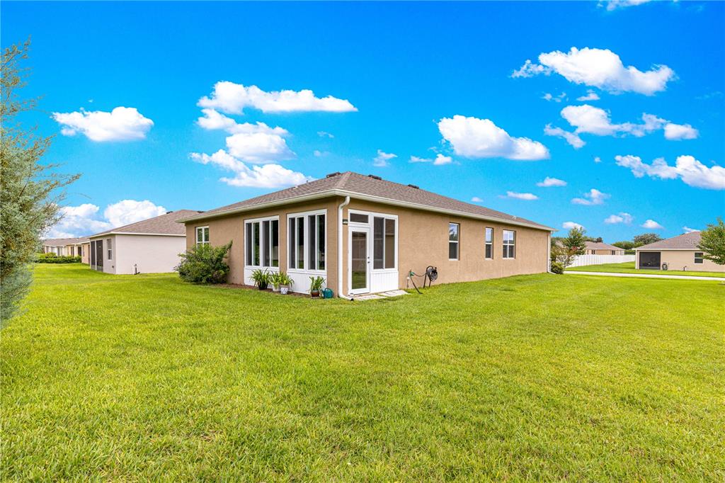6365 Southwest 88th Loop Ocala, FL 34476 - Photo 7 of 35 a view of a house with a big yard