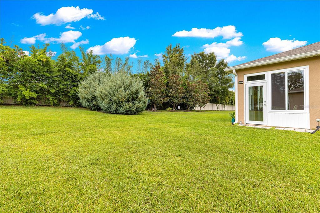 6365 Southwest 88th Loop Ocala, FL 34476 - Photo 8 of 35 a view of a house with a big yard