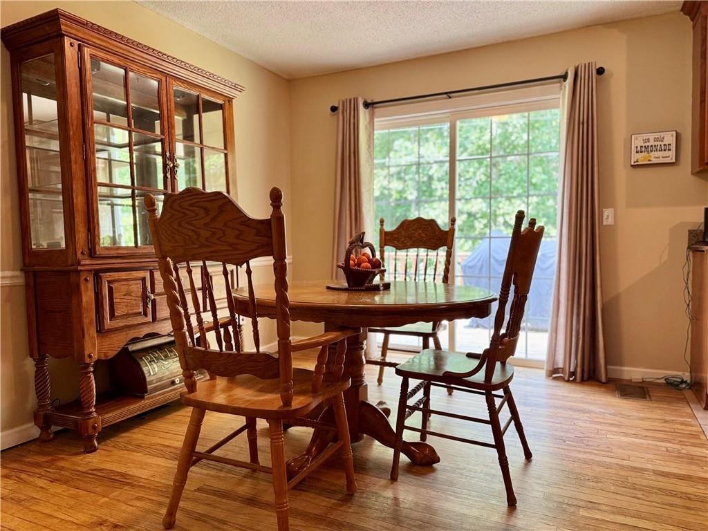 94 Big Jim Road Cleveland, GA 30528 - Photo 11 of 25 a view of a dining room with furniture window and wooden floor