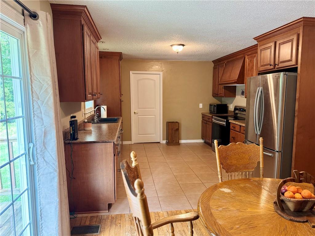 94 Big Jim Road Cleveland, GA 30528 - Photo 13 of 25 a kitchen with a refrigerator and a refrigerator