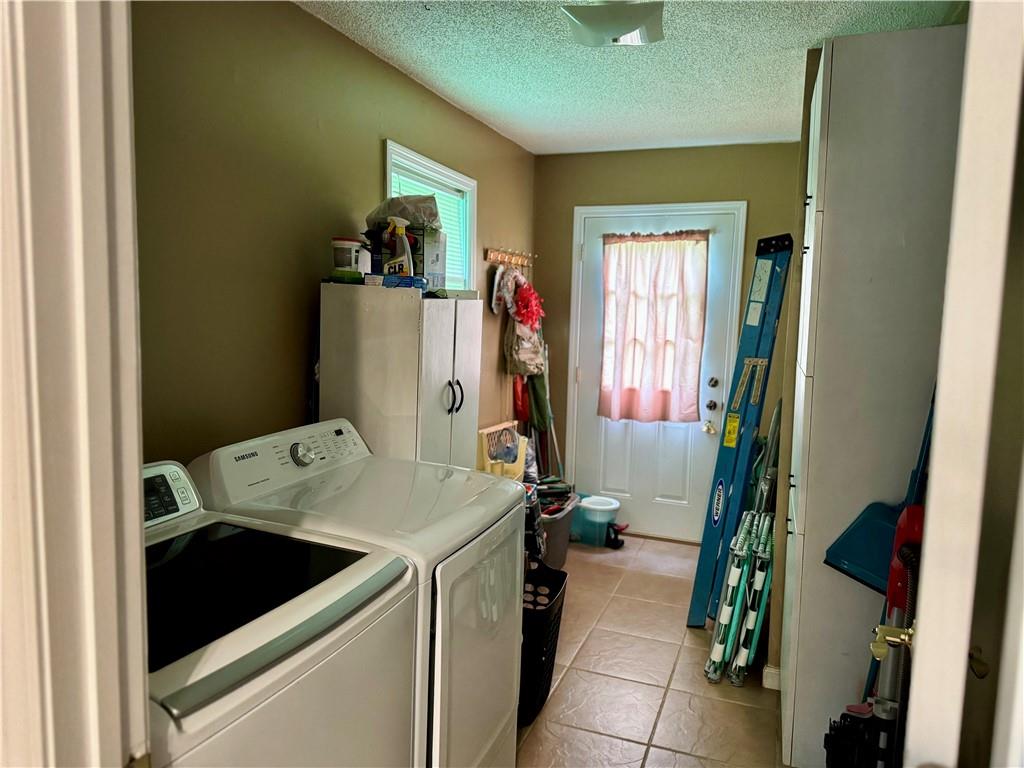 94 Big Jim Road Cleveland, GA 30528 - Photo 16 of 25 a utility room with dryer and washer