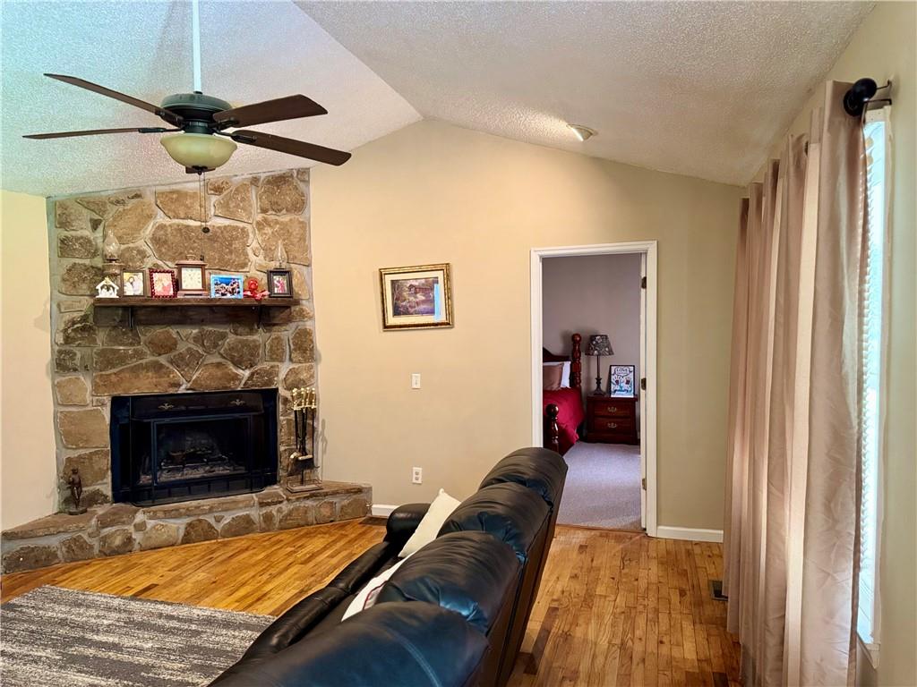 94 Big Jim Road Cleveland, GA 30528 - Photo 5 of 25 a living room with furniture and a fireplace