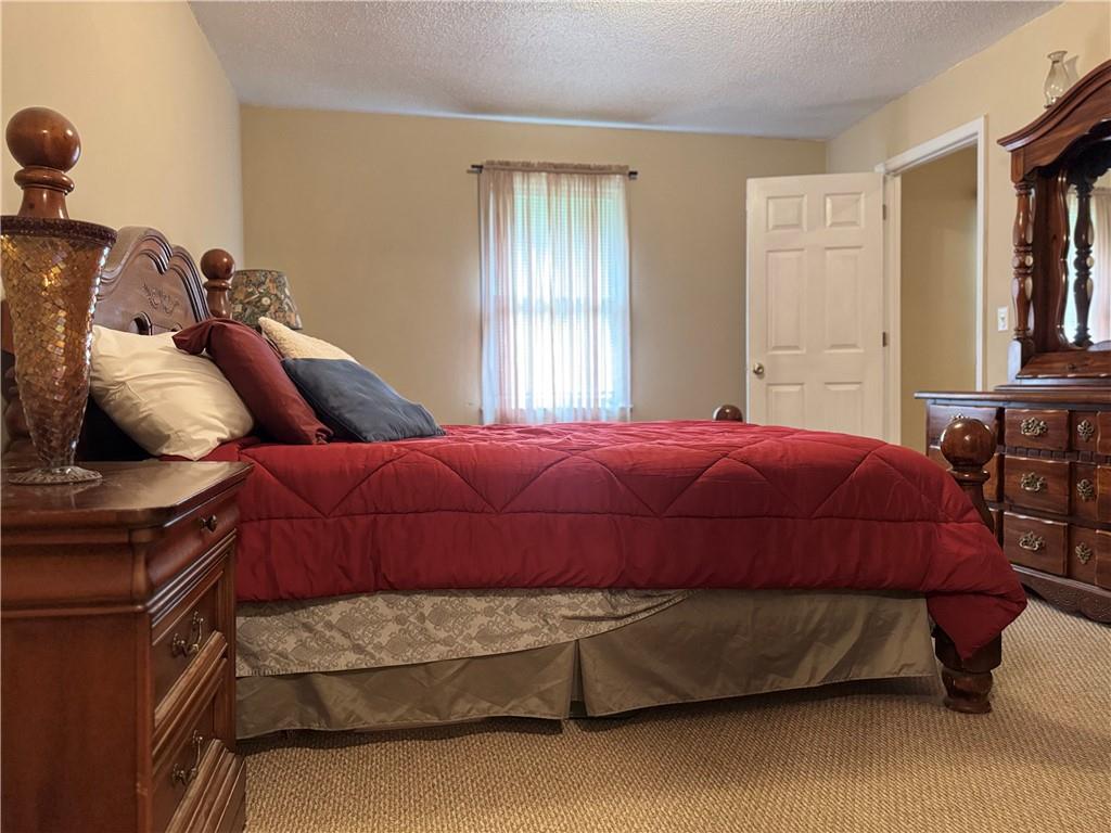 94 Big Jim Road Cleveland, GA 30528 - Photo 8 of 25 a bedroom with a bed and window