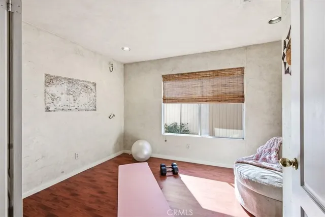 a room with a bed and a desk