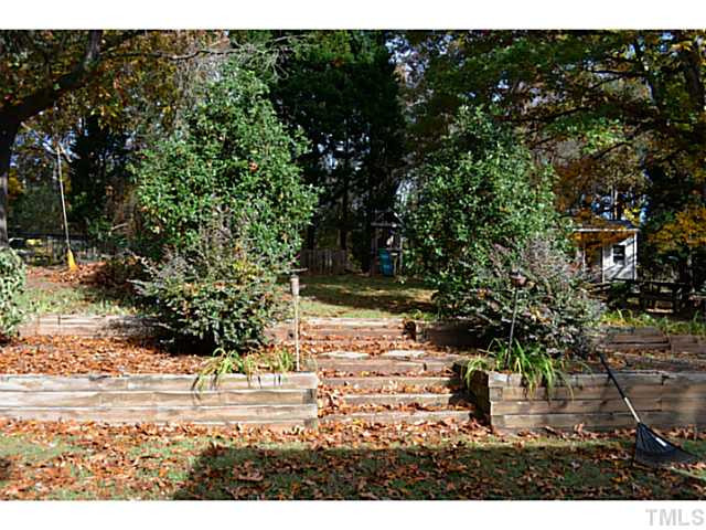9936 Baileywick Road Raleigh, NC 27613 - Photo 20 of 24 Nice steps leading to the garden area and play area Back Yard