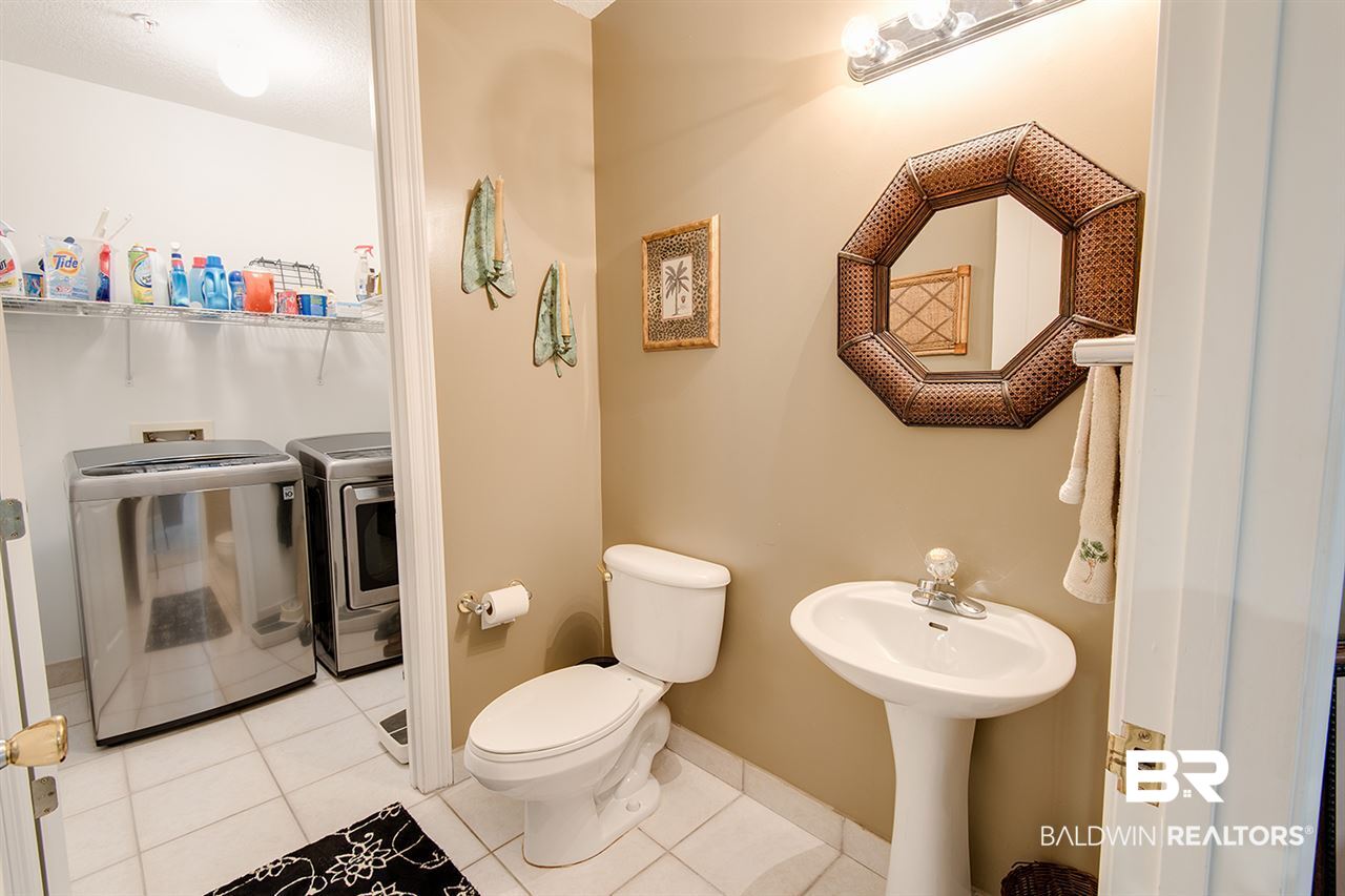27284 Gulf Road, Unit 213 Orange Beach, AL 36561 - Photo 17 of 40 Settled off the kitche and separate w/d area.