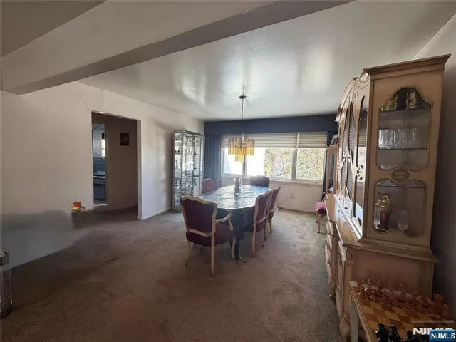 a view of a livingroom with furniture and windows
