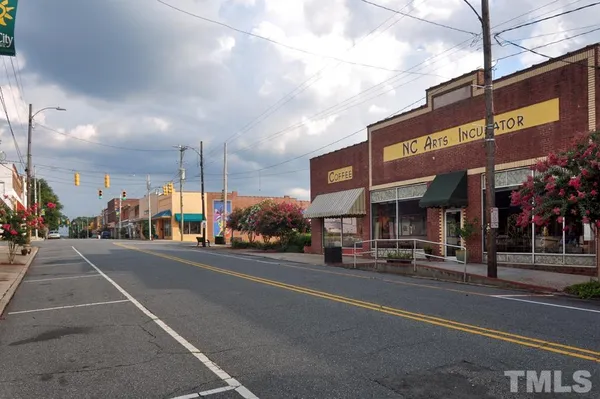 a view of a street with cars on the road