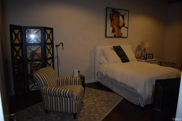 a bedroom with double bed and a window