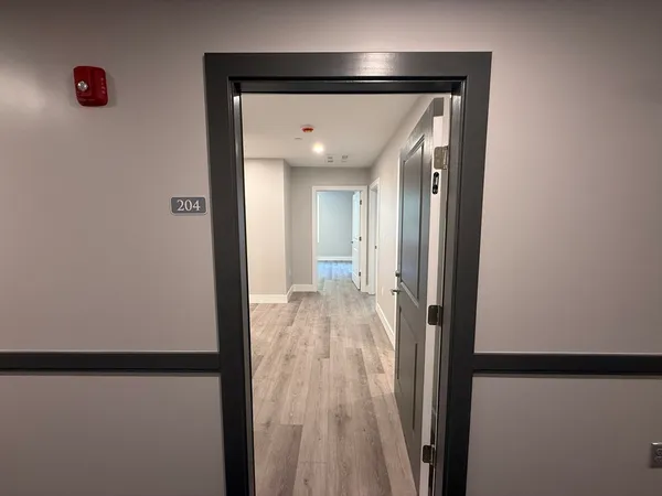 a front view of building with yard