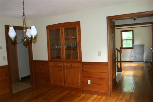7 Brown Road Harvard, MA 01451 - Photo 12 of 22 a view of a hallway with wooden floor and a potted plant