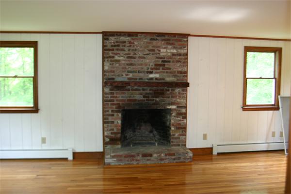 7 Brown Road Harvard, MA 01451 - Photo 14 of 22 a living room with a fireplace