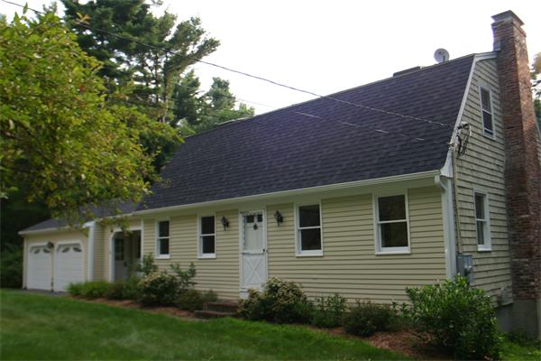 7 Brown Road Harvard, MA 01451 - Photo 20 of 22 a front view of a house with a garden