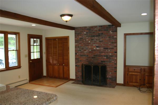 7 Brown Road Harvard, MA 01451 - Photo 4 of 22 an empty room with windows and fireplace