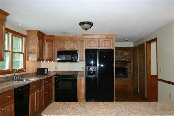 7 Brown Road Harvard, MA 01451 - Photo 8 of 22 a kitchen with a sink and refrigerator