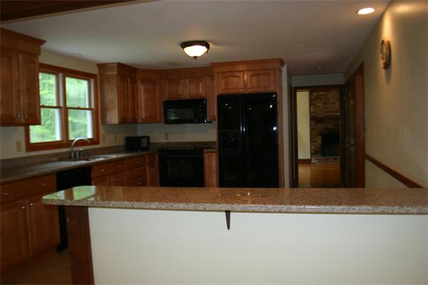 7 Brown Road Harvard, MA 01451 - Photo 10 of 22 a kitchen with kitchen island a sink stainless steel appliances and window