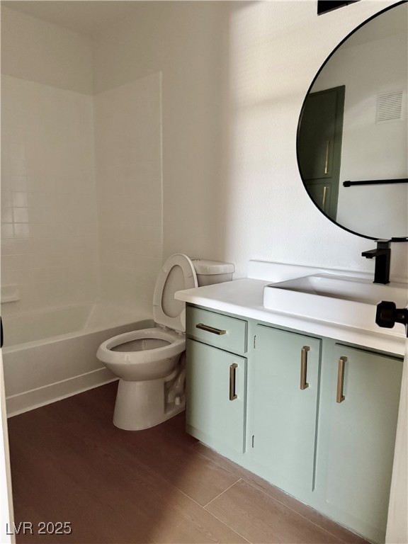 1150 North Buffalo Drive, Unit 2025 Las Vegas, NV 89128 - Photo 11 of 20 Full bath with vanity, wood finished floors, and bathtub / shower combination