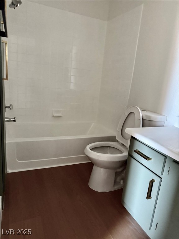 1150 North Buffalo Drive, Unit 2025 Las Vegas, NV 89128 - Photo 12 of 20 Full bathroom with wood finished floors, vanity, and washtub / shower combination